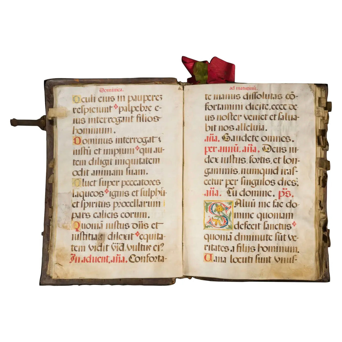 Manuscrito iluminado del siglo XVI abierto, material muy sensible a luz y humedad