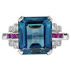 Anillo de Compromiso de Oro con Topacio Azul, Rubí y Diamante